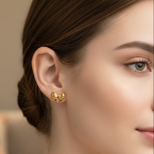 Bow earring in matt Gold polish