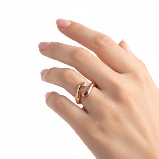 Gold ring in a jewelry box on a marble surface