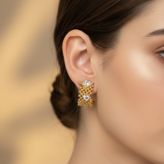 Gold earrings with clear stones