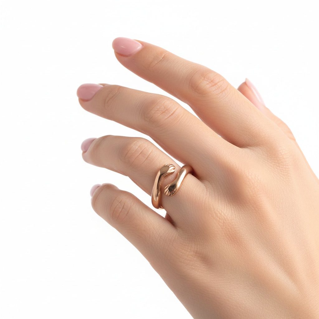 Gold ring in a jewelry box on a marble surface
